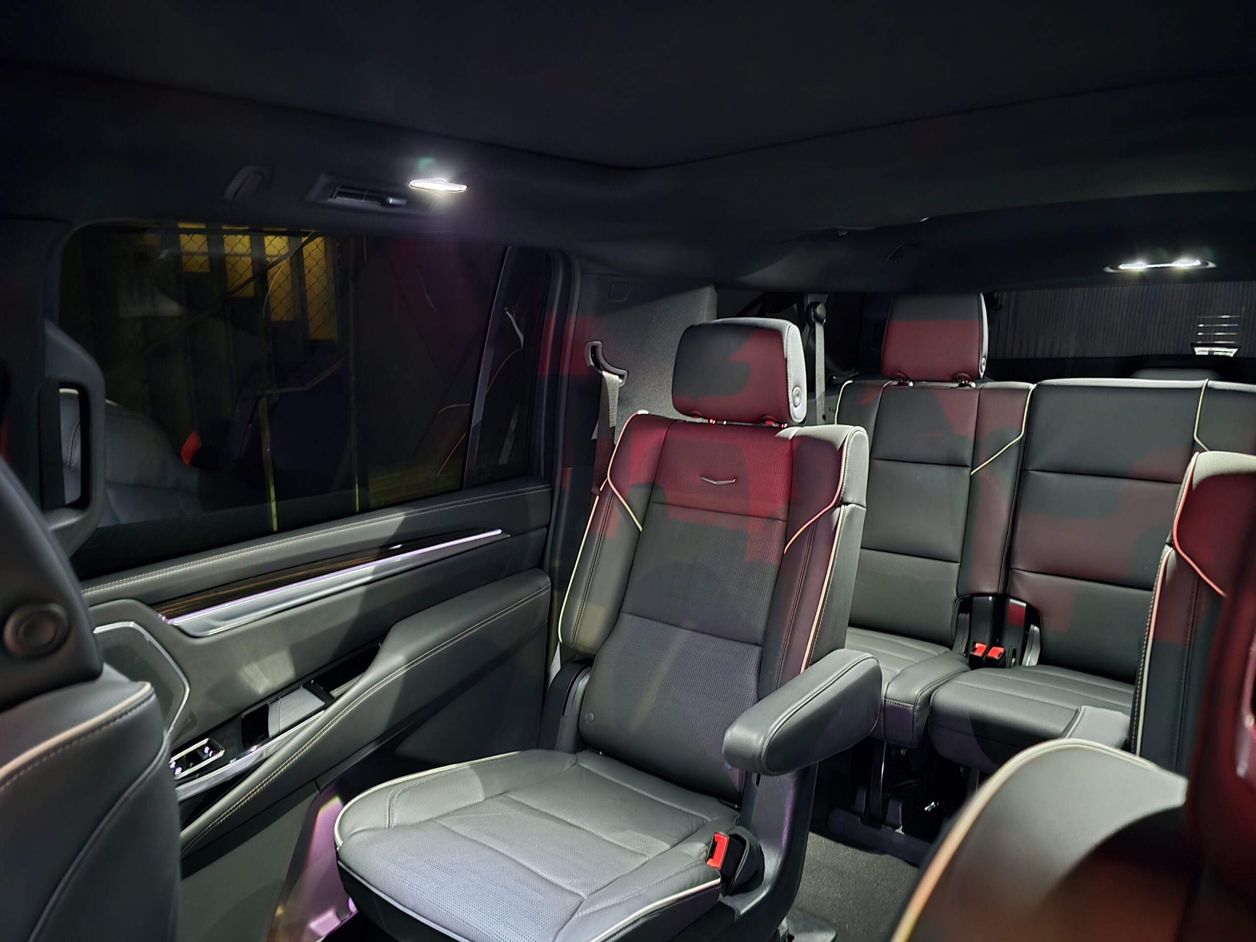 Luxury black SUV showcasing sleek design and detailed front grille, emphasizing modern elegance and performance features.